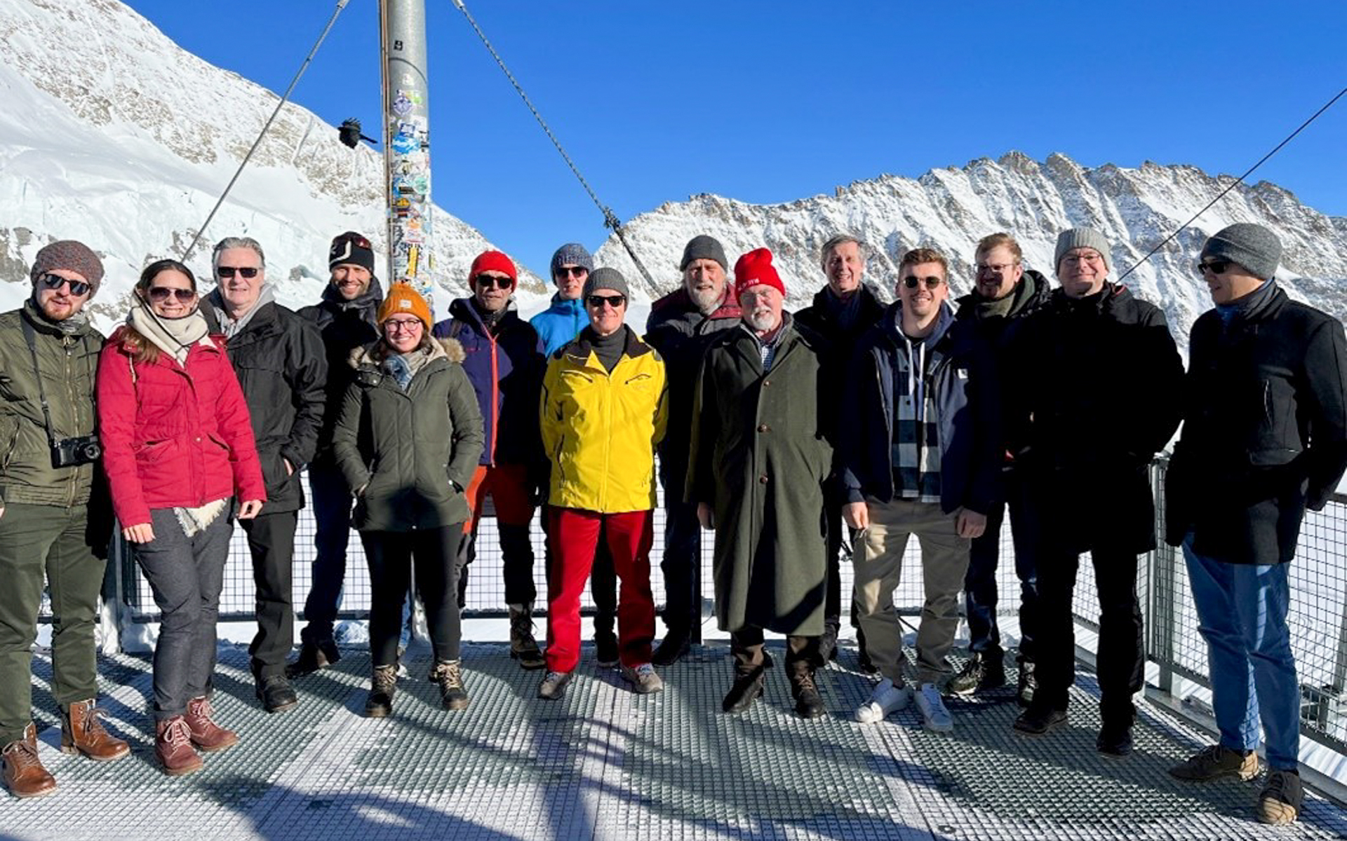 Group photo of the participants of the AHORN22 meeting. A mountain range is visible in the background.