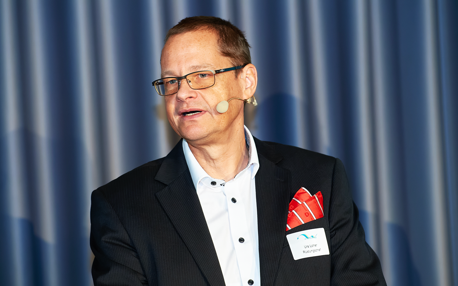 Urs Loher während seiner Rede auf dem Textilsymposium 2024.