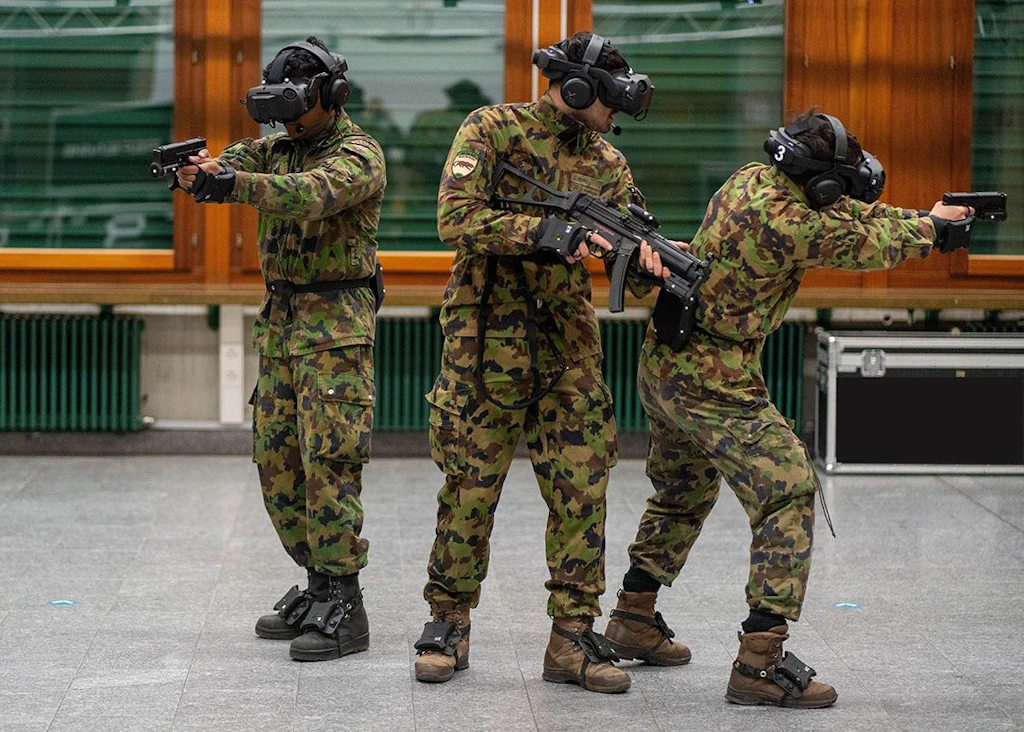 Three soldiers are practicing complex missions in a virtual environment
