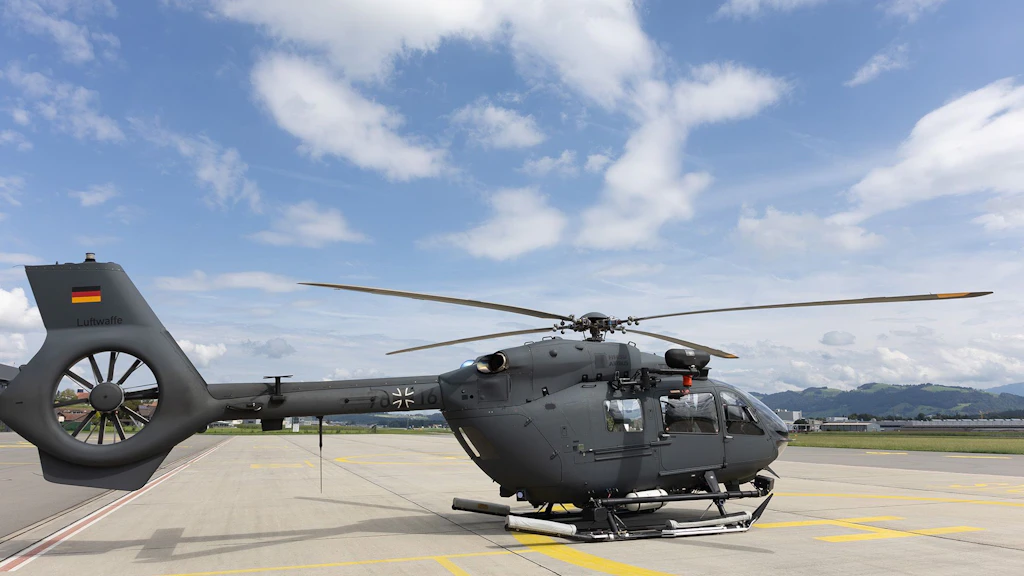 A dark helicopter can be seen on the starting point.