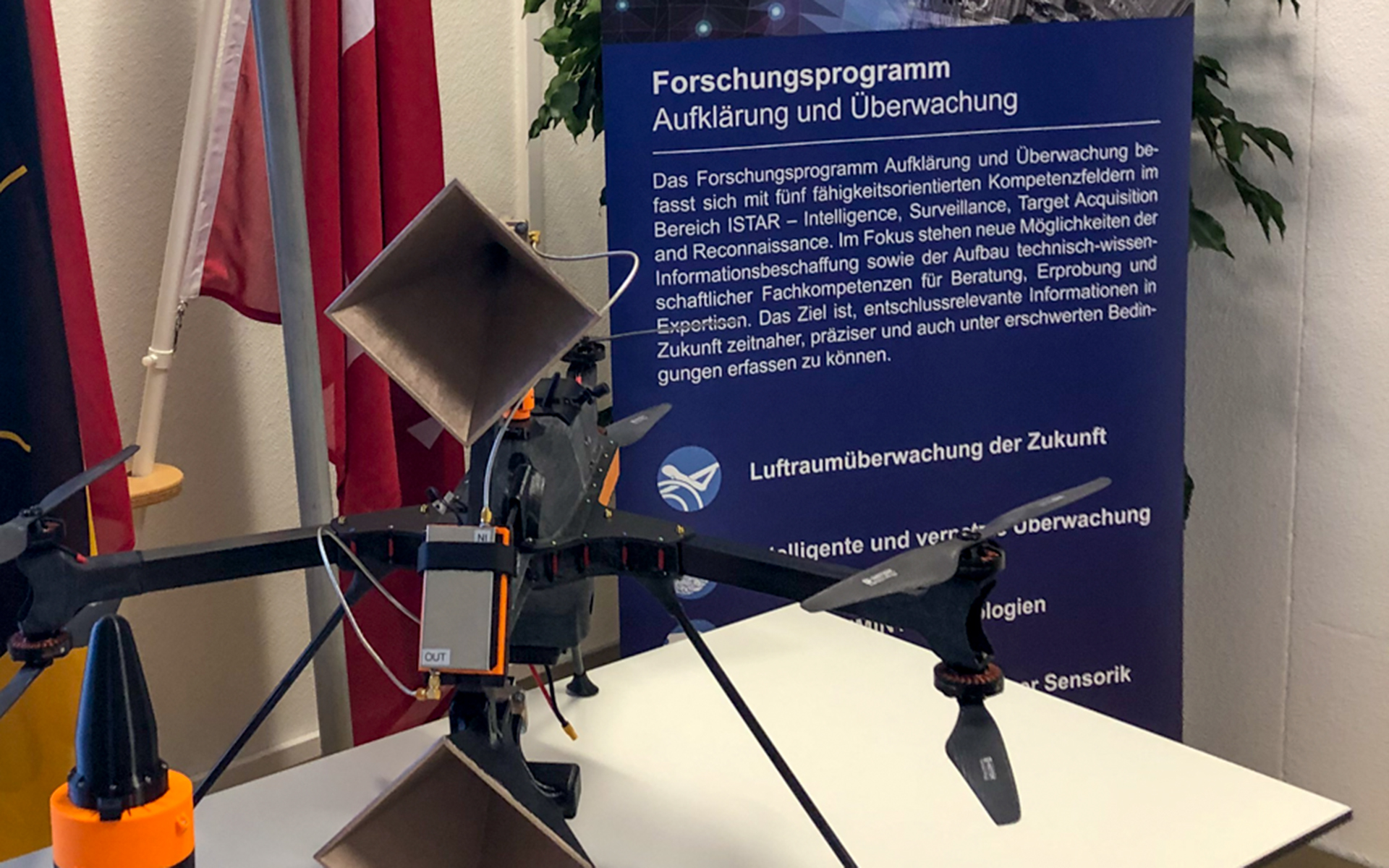 A drone equipped with measurement sensors sits on a table.